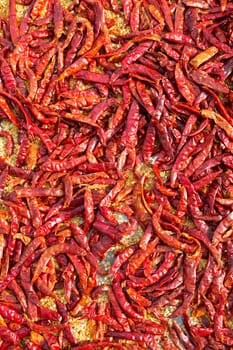 close up of red dried chili flakes food background