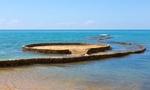 stone path in the sea on the beach in Koh Chang, Thailand