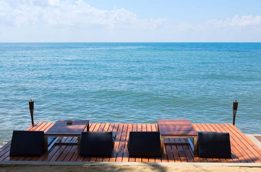 Sea, sun beds for sun on the wooden floor.