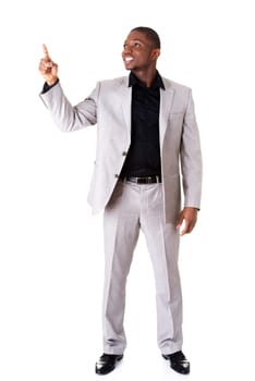 Happy successful businessman pointing on copy space. Isolated on white.
