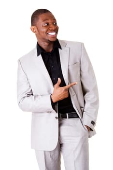 Happy successful businessman pointing on copy space. Isolated on white.