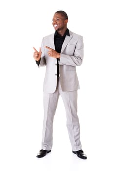 Happy successful businessman pointing on copy space. Isolated on white.