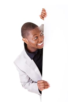 Happy successful businessman holding and showing blank advertisement. Isolated on white.