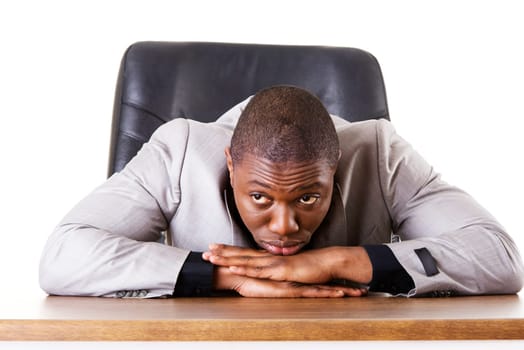 Sad, tired or depressed businessman at the desk.