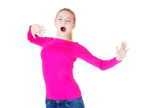 Beautiful blond woman in pink  blouse, yawning and stretching
