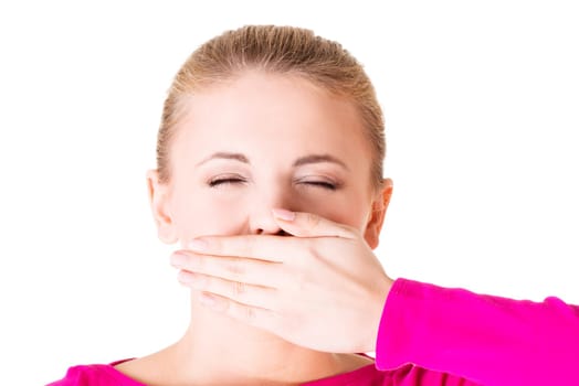 Young woman covering her mouth, isolated on white
