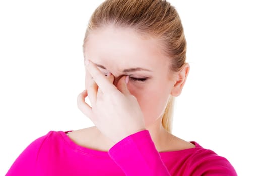 Young woman with sinus pressure pain , isolated on white