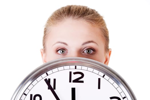 Portrait of shocked woman with clock over white background