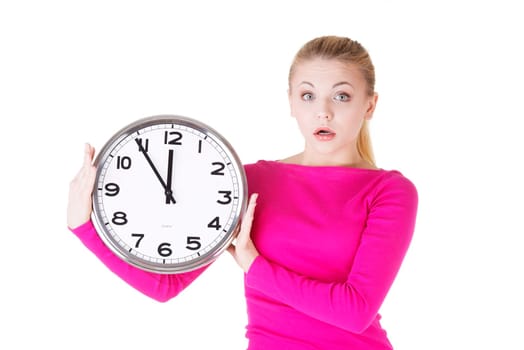Portrait of shocked woman with clock over white background