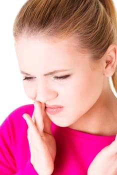 Teen woman pressing her bruised cheek with a painful expression as if she's having a terrible tooth ache.