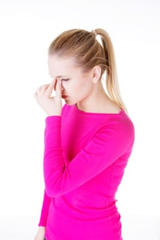 Young woman with sinus pressure pain , isolated on white