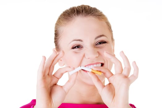 Young woman with broken cigarette. Stop smoking concept.