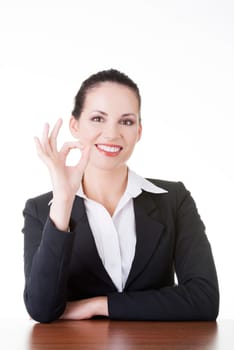 Young woman at the desk gesturing perfect , isolated on white