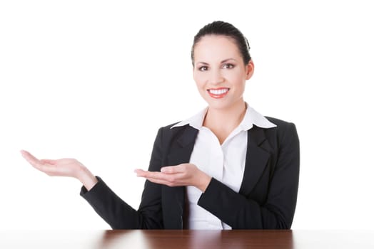 Happy young business woman showing copy space on her palm, isolated on white