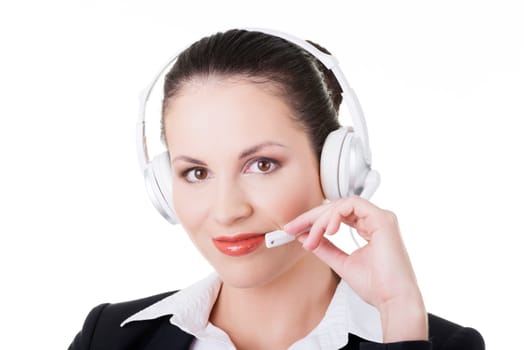 Beautiful young call-center assistant at the desk, isolated on white