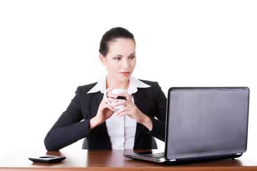 Beautiful brunette businesswoman working on laptop computer isolated on white