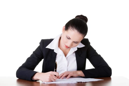 Beautiful attractive corporate lawyer business woman sitting at desk and writing blank paper page, isolated on white background.