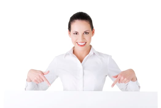 Attractive businesswoman holding blank board. Isolated on white