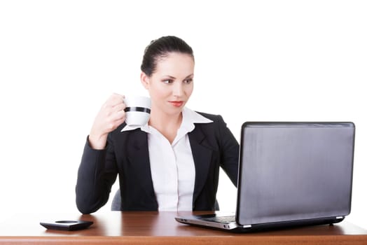 Beautiful brunette businesswoman working on laptop computer isolated on white