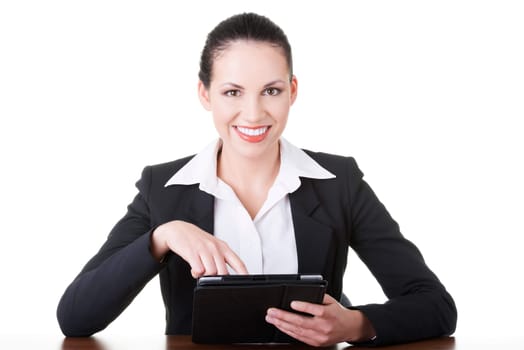 Businesswoman working on tablet computer with touch pad. Isolated on white.
