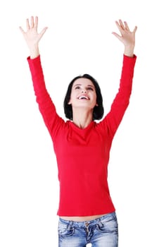 Excited happy young woman with hands up, isolated