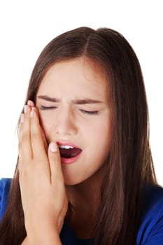 Teen woman pressing her bruised cheek with a painful expression as if she's having a terrible tooth ache.