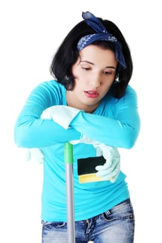 Tired frustrated and exhausted cleaning woman, isolated on white