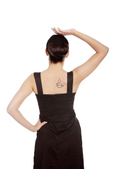 Elegant woman in dress with coffee symbol on her back.