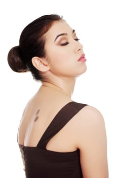 Elegant woman in dress with coffee symbol on her back.
