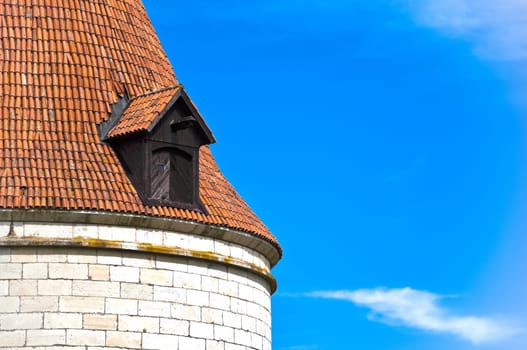 beautiful old roof top of Kuressaare castle tower with blue sky in background(Saarema, Estonia)
