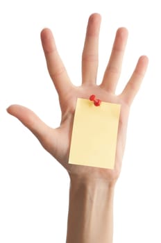 female hand with sticky office note isolated on white background . Note is blank and yellow
