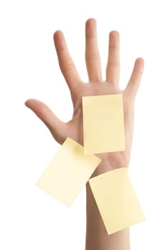 female hand with three sticky office notes isolated on white background . Notes are blank and yellow