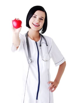 Young nurse with heart in her hand