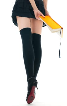 view of the lower body part isolated on white background of woman wearing skirt, stockings and high heels