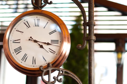 beautiful old clock in the street of town in europe
