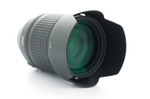 photo zoom lens isolated on white, shallow depth of field, focus on lens hood