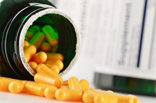Composition with dietary supplement capsules. Drug pills