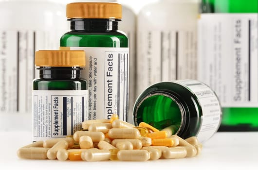 Composition with dietary supplement capsules. Drug pills