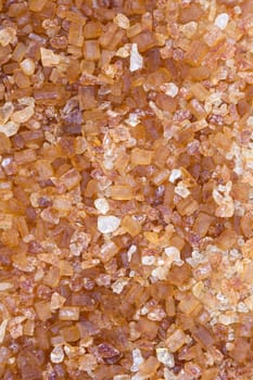Raw brown sugar from sugar cane. Isolate on white