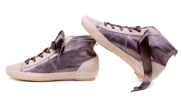 Pair of fashionable sneakers. Isolated on white.