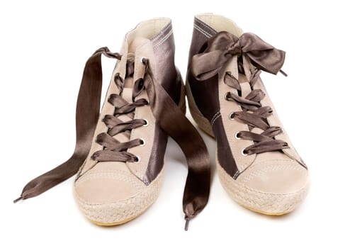 Pair of fashionable sneakers, isolated on white background