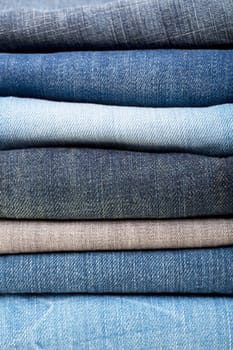 stack of blue jeans background colors