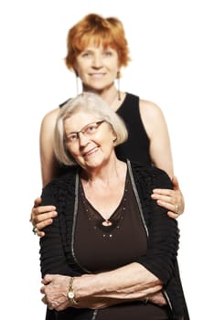 studio shot of two women. mother and daughter.