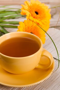 tea with cake and gerberas flowers
