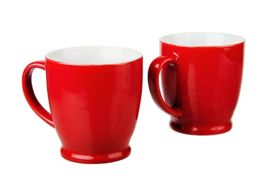 Two red ceramic mug, isolated on white