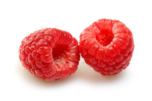 raspberries over white background