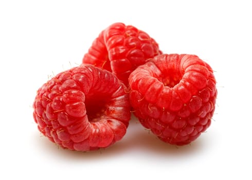 raspberries over white background