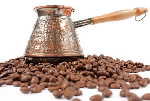 photo of the coffee pot on coffee beans with white backgroud