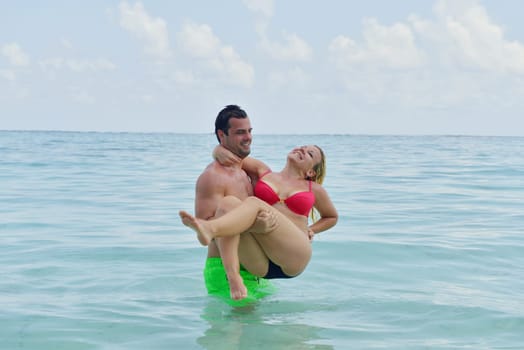happy young  couple at summer vacation have fun and relax at beautiful sunny  day
