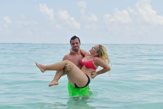 happy young  couple at summer vacation have fun and relax at beautiful sunny  day